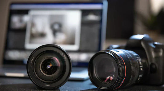 Digital camera lenses displayed for resale evaluation at PayMore Snellville