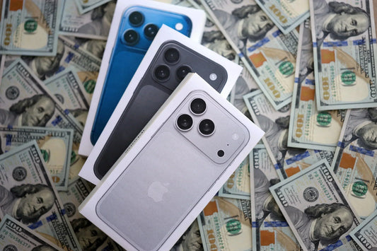 Assorted iPhone 11 and newer models displayed for resale at PayMore Snellville